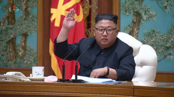 North Korean leader Kim Jong-un attends a Politburo meeting on April 11, his last public appearance in weeks. [YONHAP]