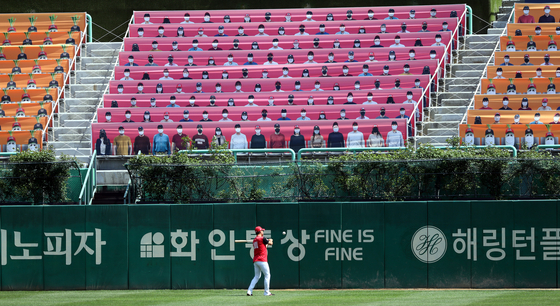 Placards featuring SK Wyverns fans fill up the stands at Incheon SK Happy Dream Park in Incheon on Monday, a day before the opening of the professional baseball league. [YONHAP]