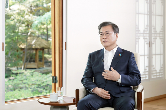 President Moon Jae-in speaks at the Blue House in an interview on the May 18 Democratization Movement in Gwangju on Sunday, the eve of the 40th anniversary of the uprising. [NEWS1]