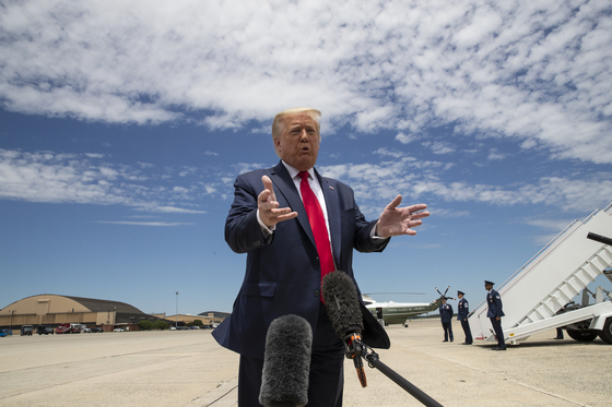 U.S. President Donald Trump speaks with reporters before boarding Air Force One to depart for Washington after visiting the Kennedy Space Center in Florida for the SpaceX launch Saturday. [AP/YONHAP]