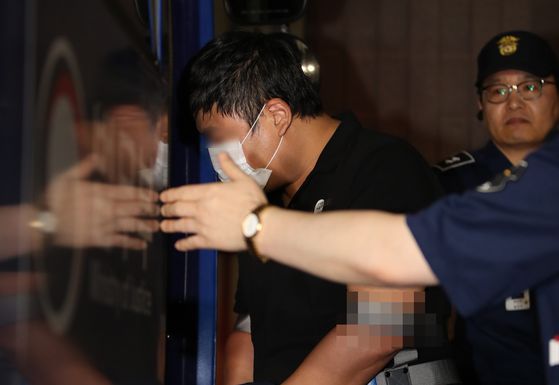 In this file photo, Cho Beom-dong, a first cousin of former Justice Minister Cho Kuk, leaves the Seoul Central District Prosecutors' Office after questioning on Sept. 16, 2019.  [YONHAP 