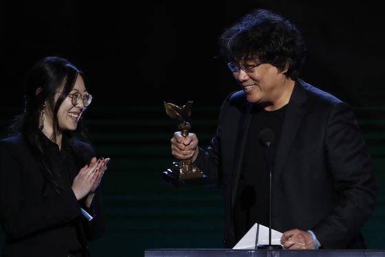 Sharon Choi, left, has been by director Bong Joon-ho's side at every step of his Oscar campaign. [AFP/YONHAP] 