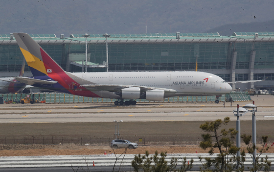 An Asiana Airlines aircraft parked at Incheon International Airport in April. [YONHAP]
