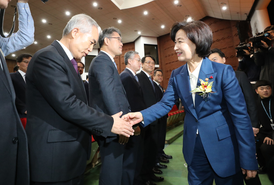 In this file photo, Justice Minister Choo Mi-ae, right, shakes hand with Yang Bu-nam, head of the Busan High Prosecutors' Office, at her inauguration ceremony on Jan. 3, 2020.  [YONHAP] 