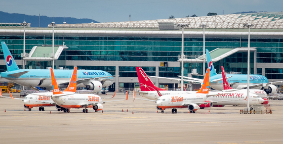 Jeju Air planes are parked at Incheon International Airport last month. [NEWS1] 