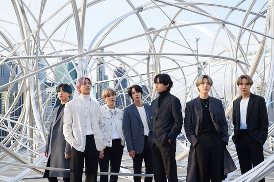 BTS stands next to Antony Gormley's installation piece "New York Clearing" as a part of its contemporary art project "CONNECT, BTS" earlier this year. [BIG HIT ENTERTAINMENT]