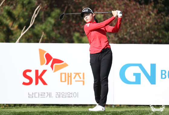 Kim You-bin watches her shot during the first round of the SK Networks Seokyung Ladies Classic at Pinx Golf Club in Jeju on Thursday. 