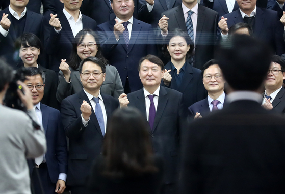 Prosecutor General Yoon Seok-youl, third from left in the front row, poses with prosecutors during a visit to a new prosecutors' training center in Jincheon, North Chungcheong, on Tuesday. [YONHAP]