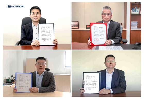 Representatives from Hyundai Motor, Shanghai Electric Power, Shanghai Sunwise Energy Systems and Shanghai Ronghe Electric Technology Financial Leasing holding an agreement to cooperate on offering Hyundai's hydrogen trucks in China. [HYUNDAI MOTOR]