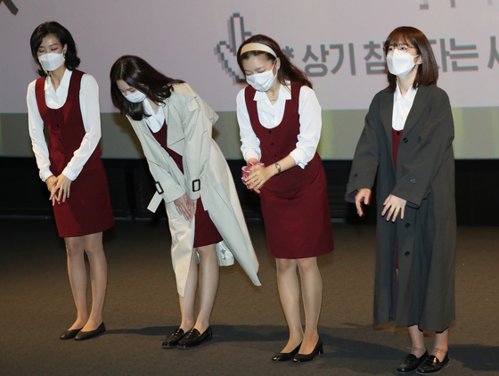 From right, actors Park Hye-soo, Go Ah-sung, Lee Som and Lee Joo-young salute the fans before the screening of the film ’Samjin Company English Class“ at the multiplex theater CGV Yongsan in central Seoul on Sunday afternoon. [ILGAN SPORTS]