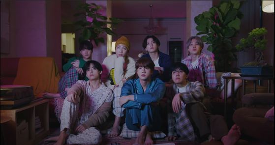 A scene from the video teaser of "Life Goes On" featuring the BTS members in pajamas. [SCREEN CAPTURE]