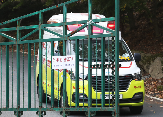 An ambulance leaves St. Raphael's Home, a group home for people with disabilities, in Yeoju, Gyeonggi, on Oct. 25, 2020. The facility was hit by cluster infections of Covid-19, and the Yeoju city government said 41 were infected from the facility as of Nov. 1, 2020.  [YONHAP] 