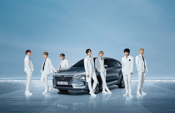 K-pop boy band BTS poses with Hyundai Motor's Nexo SUV. [NEWS1]