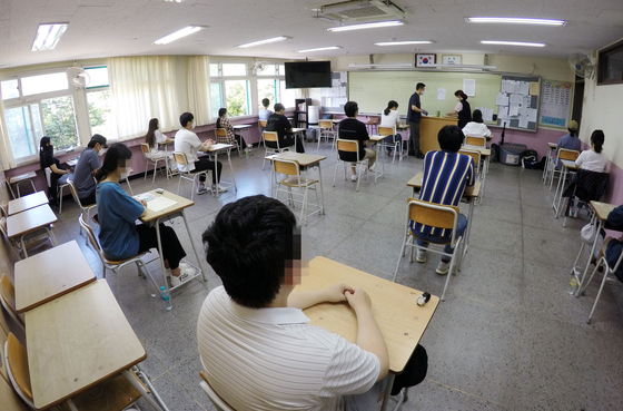 In this file photo, a civil service exam for entry-level positions is held at a high school in Seoul on July 11, 2020.  [YONHAP] 
