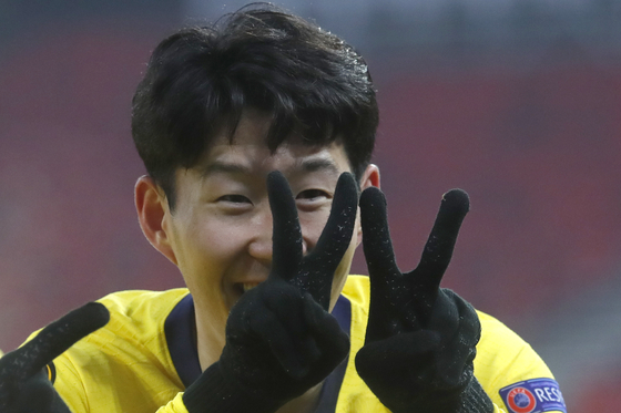 Tottenham Hotspur's Son Heung-min celebrates after scoring his side's first goal during the Europa League round of 32, first leg, match against Wolfsberger AC at the Puskas Arena stadium in Budapest, Hungary, on Thursday. [AP/YONHAP]
