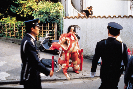 Artist Lee Bul in her monster costume in Tokyo during her 12-day performance ″Sorry for suffering - You think I'm a puppy on a picnic?″ in 1990. [LEE BUL]