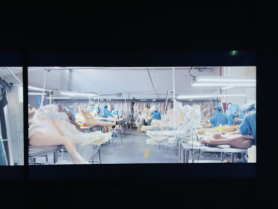 A captured image from Jung Yoon-suk's ″Tomorrow″ (2020) shows sex dolls at a manufacturing factory in China. [JOONGANG ILBO]