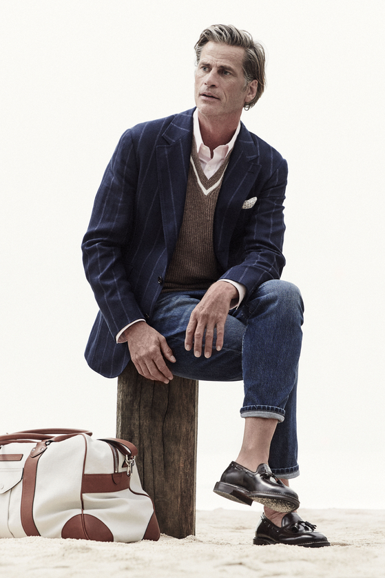 Blue jeans paired with a striped suit jacket. [BRUNELLO CUCINELLI]