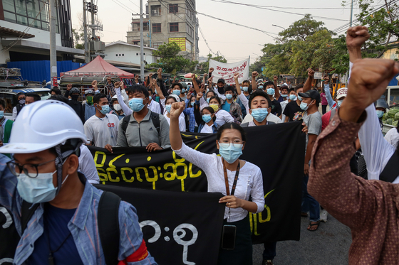 Demonstrators march during an anti-military coup protest in Mandalay, Myanmar, on Monday, amid intensifying violent crackdowns on protesters by security forces. [EPA/YONHAP]