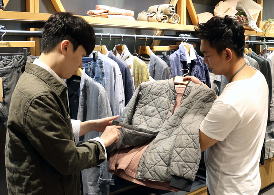 A male customer shops at a fashion store at Shinsegae Department Store. [SHINSEGAE DEPARTMENT STORE]
