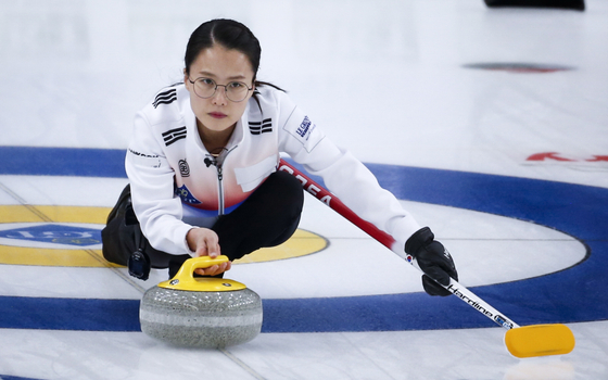 Korea skip Kim Eun-jung makes a shot against the United States during a match at the Women's World Curling Championship in Calgary, Canada on May 1.