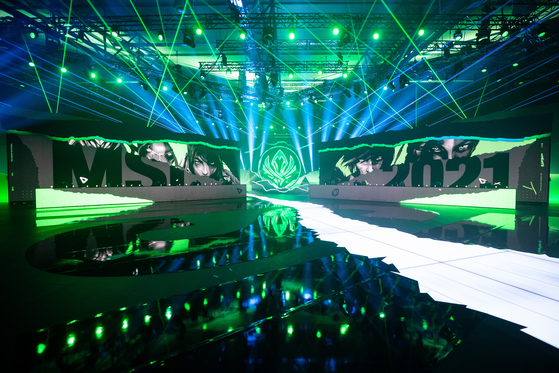 Indoor sporting arena Laugardalshöll is lit in green for the 2021 Mid-Season Invitational. [RIOT GAMES]