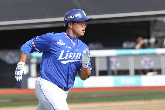 Samsung's Kim Min-su rounds the bases after hitting the first home run of his career in a game against the Lotte Giants at Daegu Samsung Lions Park in Daegu on Friday. [YONHAP]