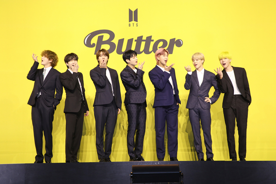 Boy band BTS poses for photos prior to the press conference held on Friday afternoon for its latest digital single ″Butter.″ [BIG HIT MUSIC]