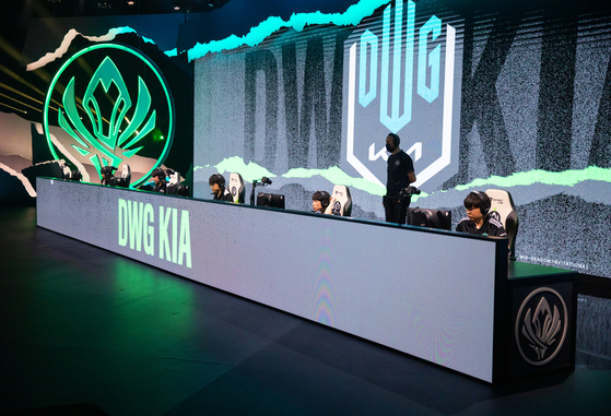 DWG KIA play on stage during the 2021 MSI finals. [RIOT GAMES]