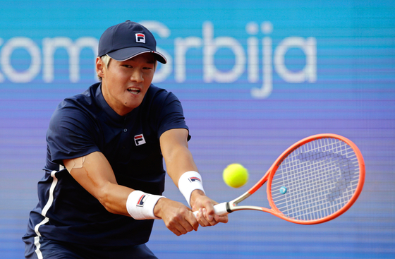 Kwon Soon-woo in action against Novak Djokovic during their second round match of the Serbia Open in Belgrade, Serbia on April 21. [EPA]