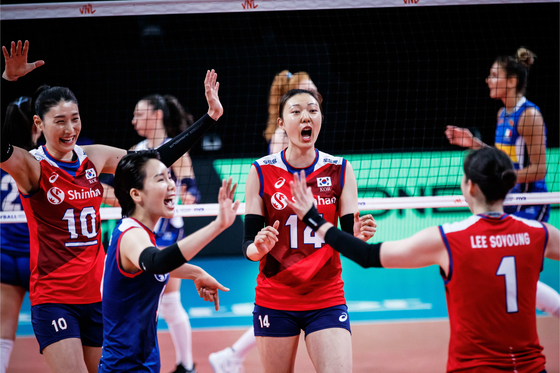 Korea’s national volleyball team captain Kim Yeon-koung, left, and libero Oh Ji-young, second from left, cheer after Team Korea score a point against Italy at the 2021 Women’s Volleyball Nations League in Rimini, Italy, on Sunday. Korea eventually lost to the Italian team 3-1 (27-25, 23-25, 25-22, 25-20). [FIVB]