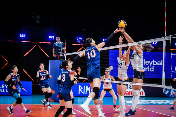 Kim Yeon-koung jousts for the ball at a Volleyball Nations League match against the Netherlands on Sunday in Rimini, Italy. [FIVB]
