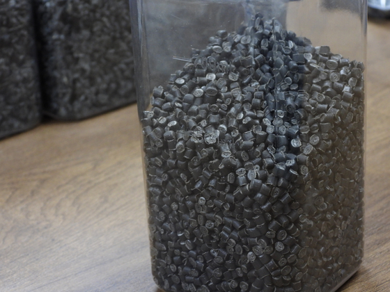 Plastic pellets produced from recycled plastic bags. [KANG CHAN-SU]