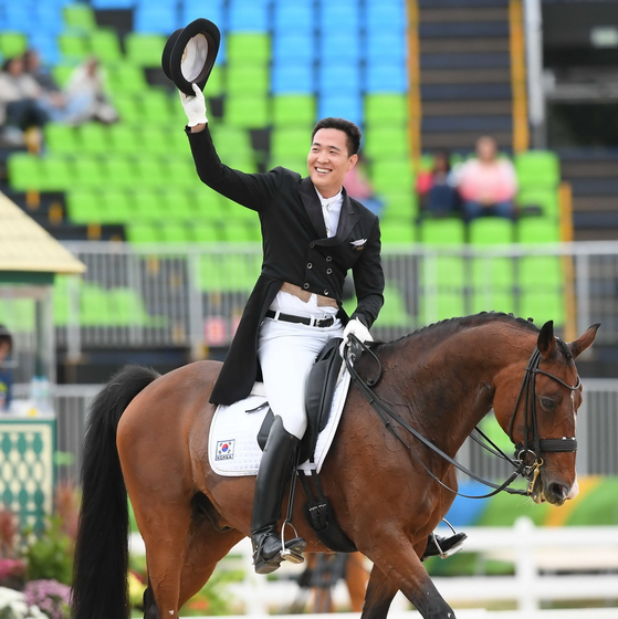 Kim Dong-seon exits the arena after the first round of dressage events at the 2016 Rio Olympics [JOINT PRESS CORPS]