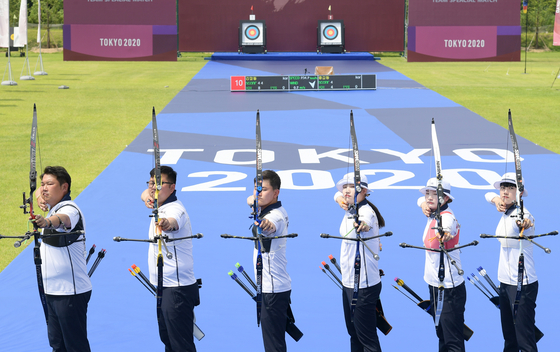 From left, Oh Jin-hyek, Kim Woo-jin, Kim Je-deok, Jang Min-hee, Kang Chae-young and An San pose for a picture during practice on June 28 at Jincheon National Training Center in Jincheon, North Chungcheong where a special set was made to resemble Yumenoshima Park Archery Field in Tokyo. [JOONGANG ILBO]