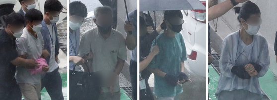Four suspects enter the Cheongju District Court on Monday to attend a warrant hearing. They were suspected of organizing protests against the government's plan to procure stealth fighter jets after receiving orders from North Korea. [NEWS1]
