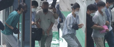 Four suspects enter the Cheongju District Court on Monday to attend a warrant hearing. They were suspected of receiving money and orders from North Korea and organizing protests and inter-Korean projects, contacting senior politicians and participating in the ruling Democratic Party's presidential campaign in 2017 and general election campaign in 2020. Three of them were detained on Monday. [YONHAP]