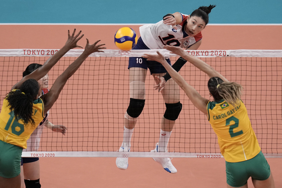 Kim Yeon-koung, center, hits the ball during the women's volleyball semifinal match between Brazil and Korea at the 2020 Summer Olympics on Friday in Tokyo. [AP/YONHAP]