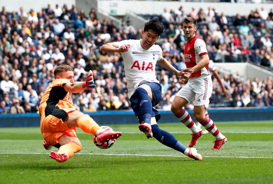 Tottenham Hotspur's Son Heung-min shoots in a friendly against Arsenal at Tottenham Hotspur Stadium on Sunday. [REUTERS/YONHAP]