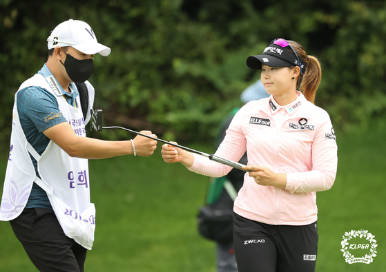 Lim Hee-jeong celebrates birdying par-5, fourth with her caddie at the final round of the HighOne Resort Ladies Open 2021 held at HighOne Country Club on Sunday. [KLPGA]