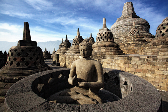 One of 72 stupas, each holding a statue of Buddha, on the Borobudur Temple Compounds in central Java, Indonesia. The temple compounds, dating back to the 8th and 9th centuries, were inscribed as a Unesco World Heritage site in 1991. [BOROBUDUR PARK MANAGEMENT]