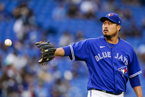 Toronto Blue Jays starting pitcher Ryu Hyun-jin waits on the ball during the first inning of a game against the Baltimore Orioles at Rogers Centre in Toronto on Tuesday. [USA TODAY/YONHAP]