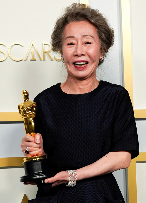 Youn Yuh-jung, winner of the award for Best Actress in a Supporting Role for ″Minari,″ poses in the press room at the Oscars in Los Angeles. [REUTERS/YONHAP]