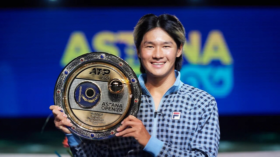 Kwon Soon-woo poses with the trophy after winning the Astana Open in Nur-Sultan, Kazakhstan on Sept. 26. [NEWS1]