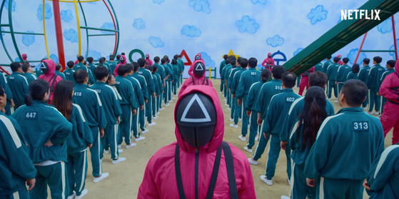 Henchmen wearing pink uniforms in “Squid Game.” [NETFLIX]