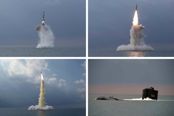 North Korea's official Rodong Sinmun Wednesday published a series of photos of its new type of submarine-launched ballistic missile (SLBM) test-fired from its "8.24 Yongung” submarine Tuesday. [RODONG SINMUN]
