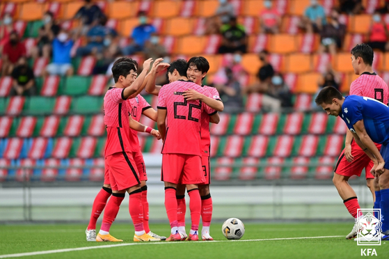 The Korean U-23 football team celebrate after scoring a goal against the Philippines at Jalan Besar Stadium in Singapore on Monday. [NEWS1] 