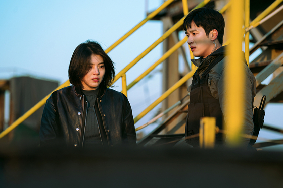Ahn plays Pil-do, a detective and Ji-woo’s partner. Ji-woo is played by actor Han So-hee, left. [NETFLIX]