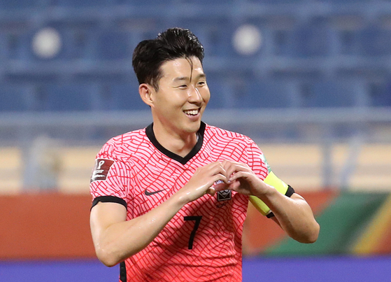 Son Heung-min celebrates scoring a penalty at the second leg of the third round of Asian qualifiers for the 2022 Qatar World Cup against Iraq at Thani bin Jassim Stadium in Doha, Qatar, on Tuesday. [NEWS1]