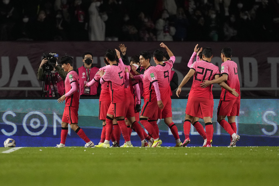 The Taeguk Warriors celebrate after Hwang Hee-chan scores the opening goal against the United Arab Emirates during the second leg of the third round of Asian qualifiers for the 2022 Qatar World Cup at Goyang stadium in Goyang, Gyeonngi on Nov. 11. [AP]